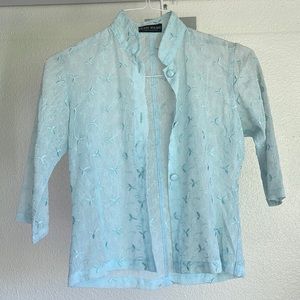 Light blue button down top with 3/4 sleeve